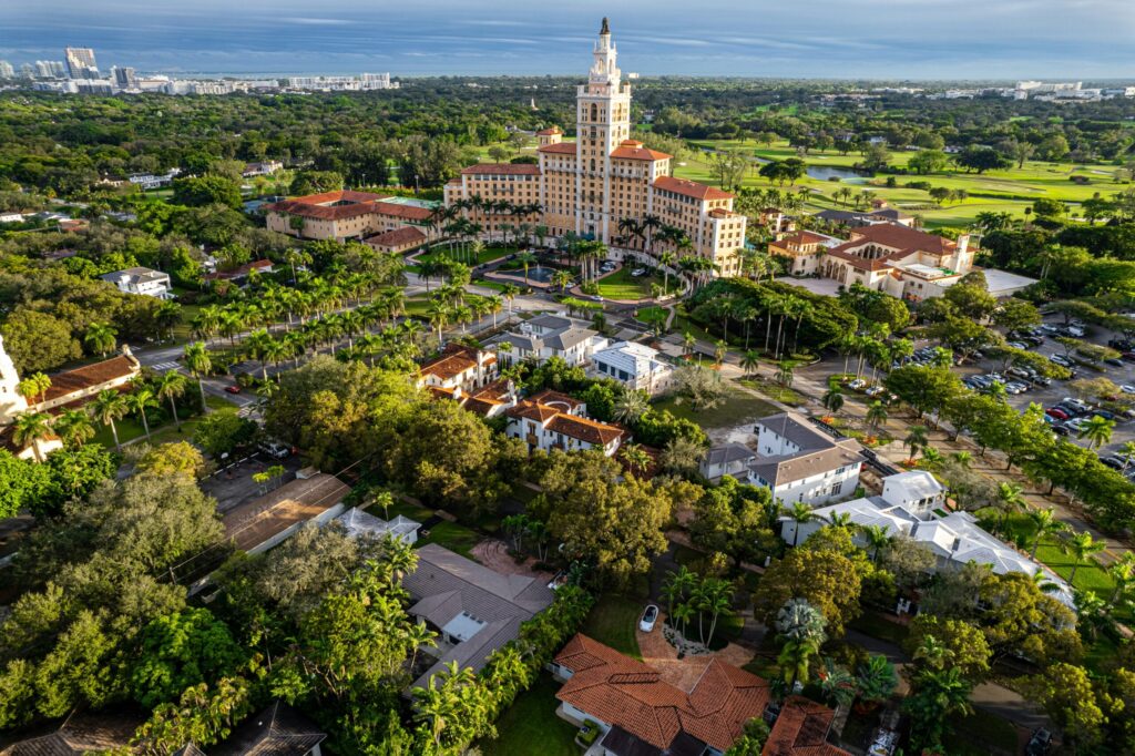 an aerial view of a city with trees and buildings